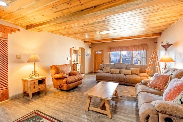 living area with baseboards, wood ceiling, arched walkways, and wood finished floors