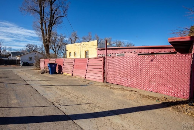 exterior space with fence and a gate