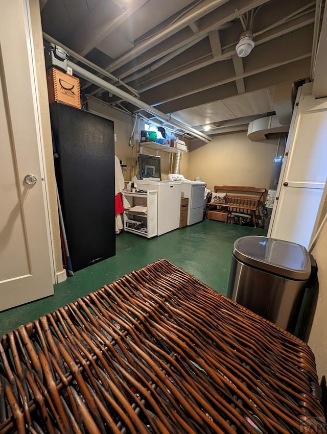 finished basement with washing machine and clothes dryer