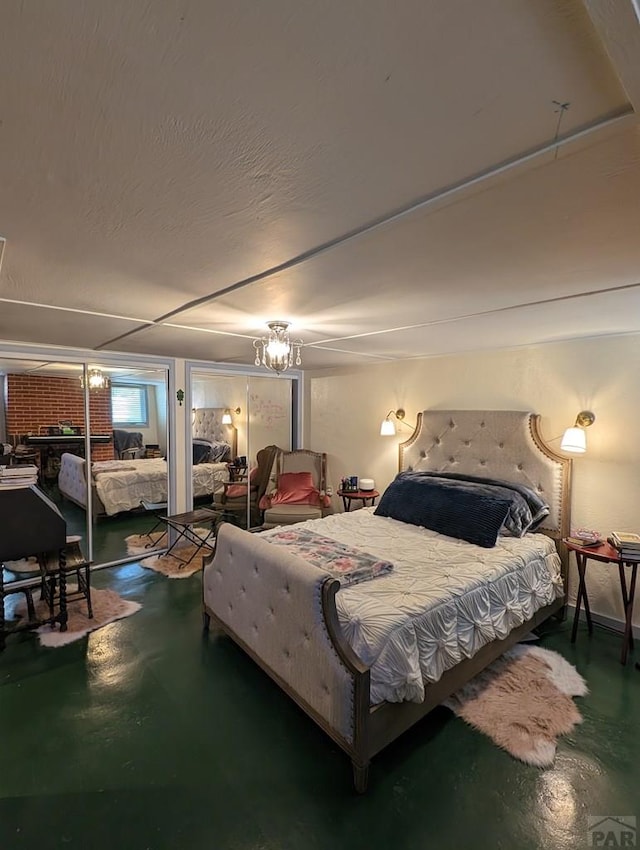 bedroom with finished concrete flooring and a textured ceiling