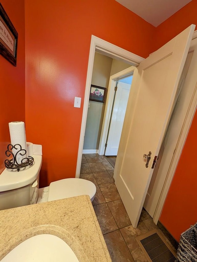 bathroom featuring tile patterned flooring, visible vents, and vanity