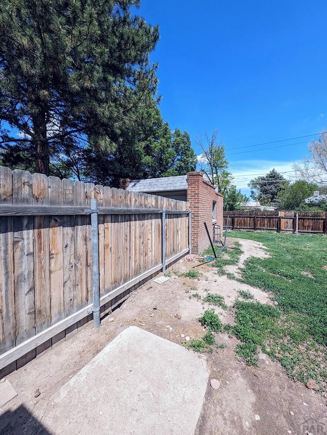 view of yard with a fenced backyard