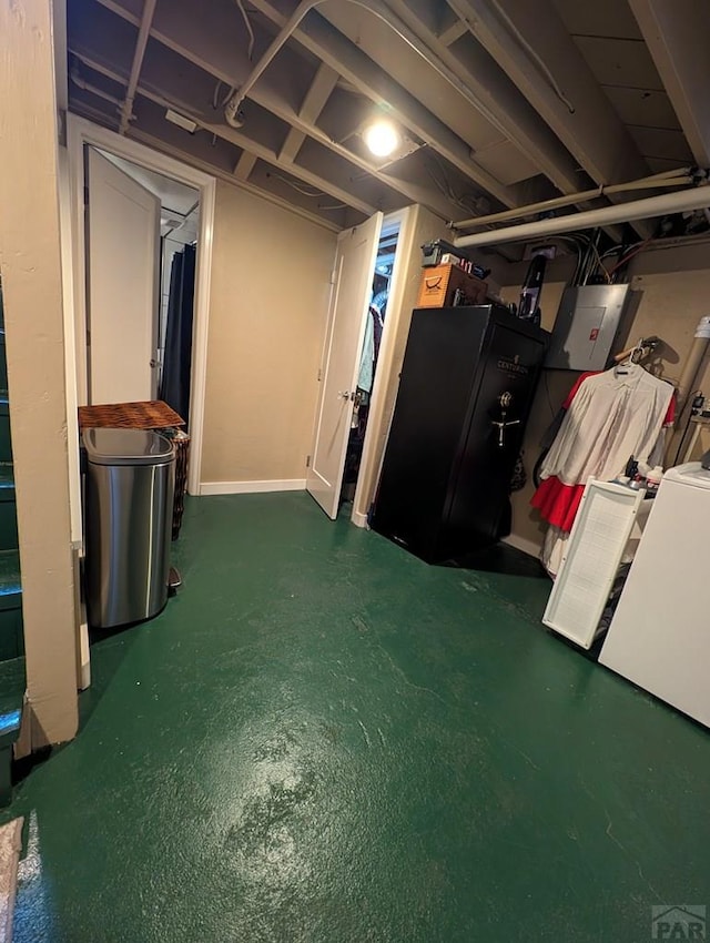 unfinished below grade area with washer / clothes dryer