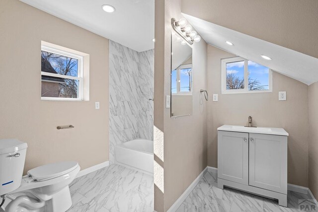 full bathroom with marble finish floor, a wealth of natural light, vanity, and baseboards