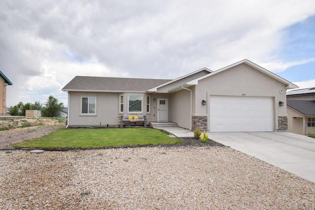 ranch-style home with a front yard, driveway, an attached garage, and stucco siding