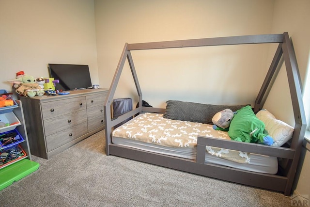 bedroom featuring light colored carpet