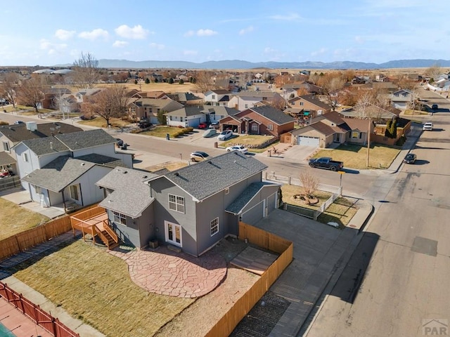 aerial view featuring a mountain view and a residential view