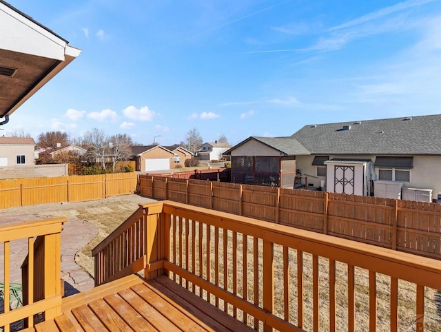 deck featuring a fenced backyard and a residential view