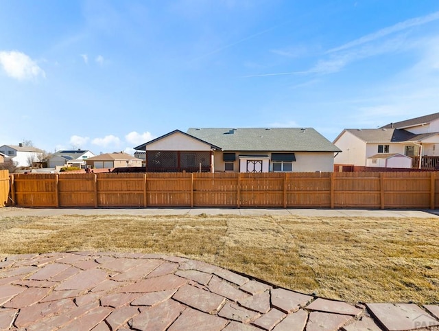 view of yard with fence and a residential view