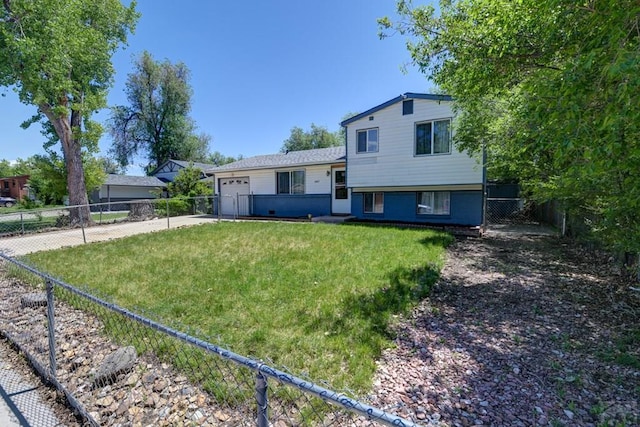 4465 London Ln, Colorado Springs, CO 80916 - tri-level home featuring driveway and an attached garage