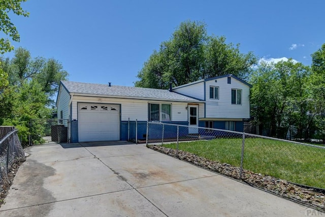 4465 London Ln, Colorado Springs, CO 80916 - tri-level home with an attached garage and driveway