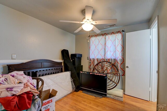 4465 London Ln, Colorado Springs, CO 80916 - bedroom featuring wood finished floors and ceiling fan