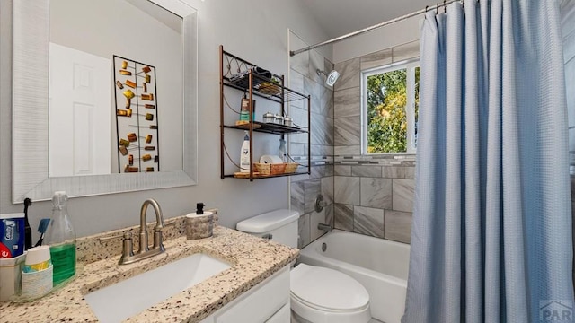 bathroom featuring toilet, vanity, and shower / tub combo with curtain