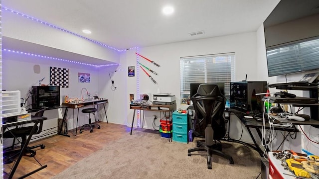 office space featuring recessed lighting, visible vents, and wood finished floors