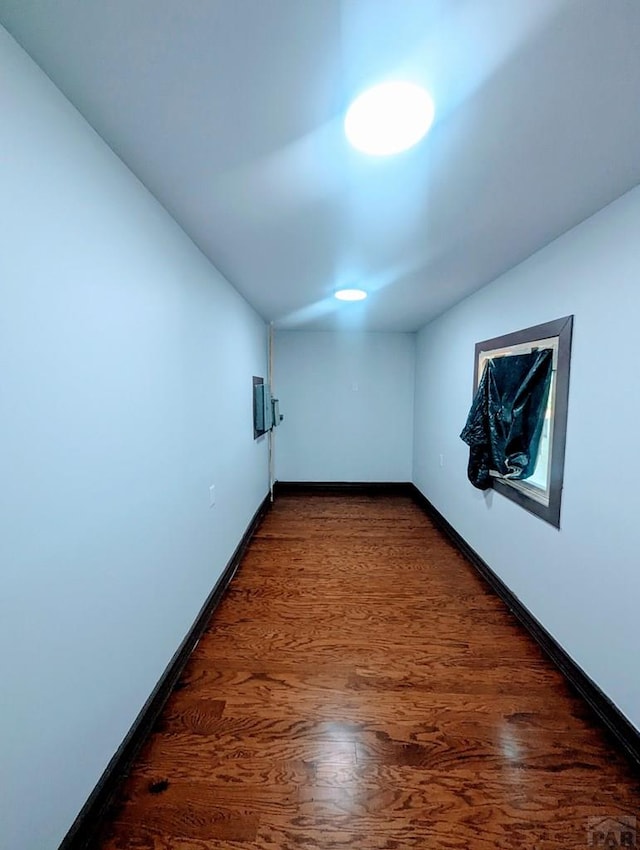 428 Elm Ave, Las Animas, CO 81054 - unfurnished room featuring baseboards and dark wood-type flooring