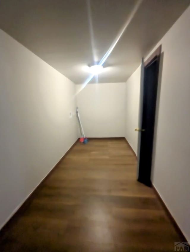 428 Elm Ave, Las Animas, CO 81054 - corridor with wood finished floors and baseboards