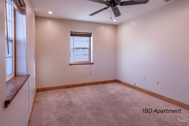 unfurnished room featuring light carpet, ceiling fan, baseboards, and recessed lighting