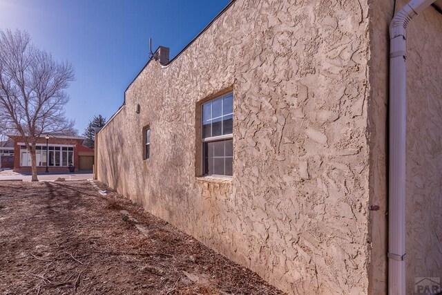 view of property exterior with stucco siding