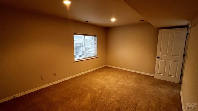 carpeted spare room with recessed lighting and baseboards