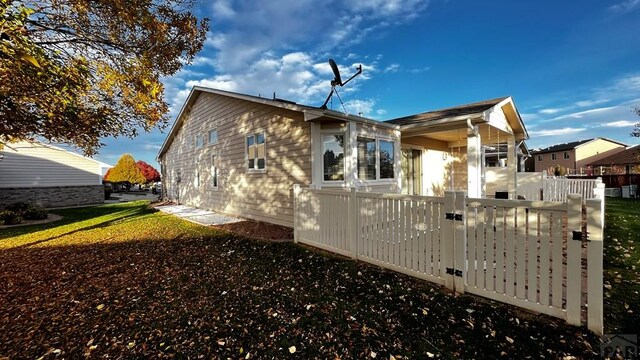 view of side of property with fence