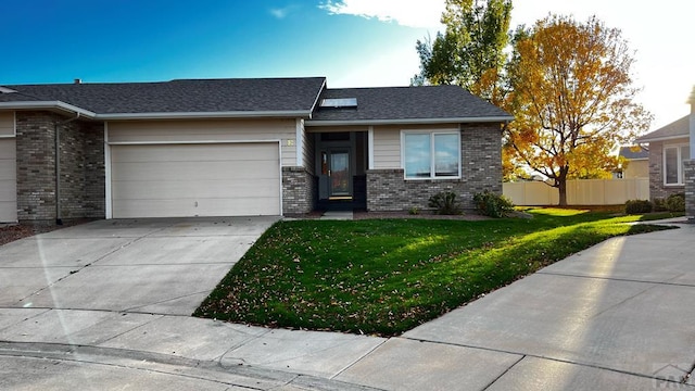 view of front of property with an attached garage, brick siding, fence, concrete driveway, and a front lawn