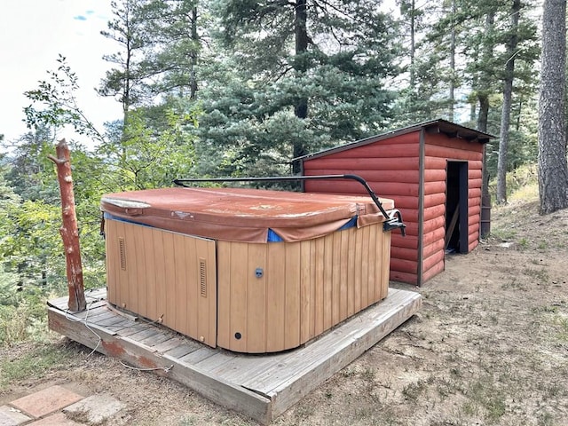 view of outbuilding with a hot tub