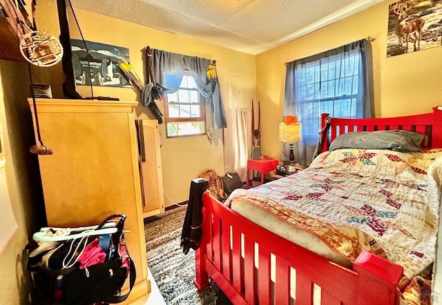 carpeted bedroom with a textured ceiling