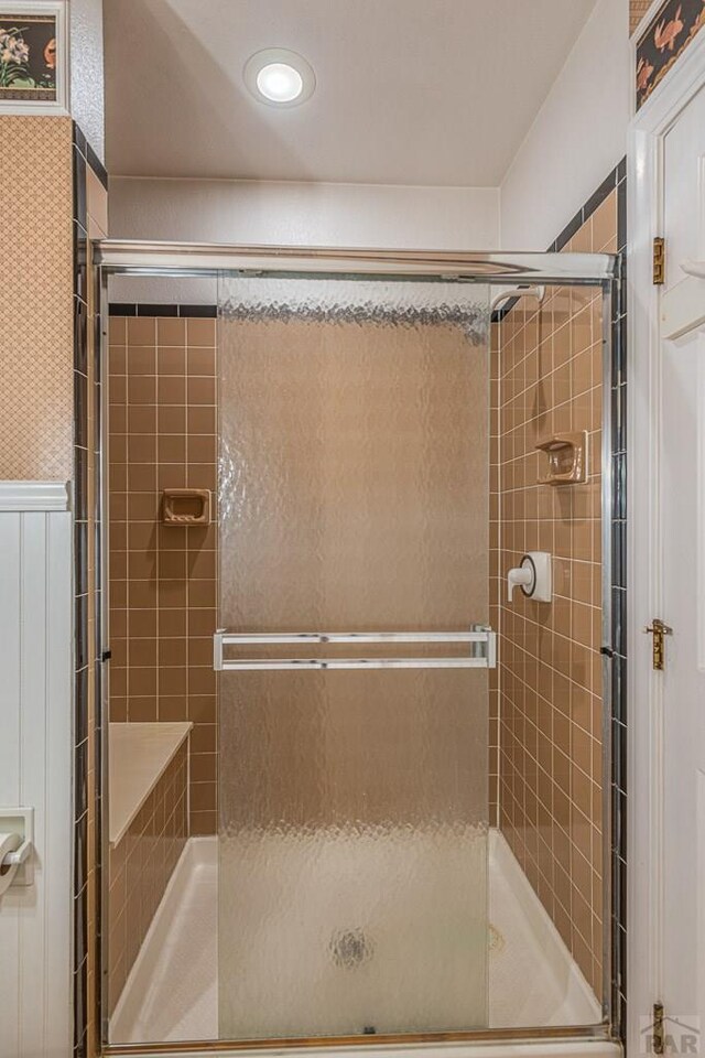 bathroom with a tile shower