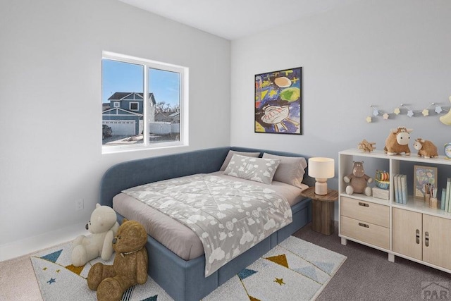 bedroom featuring dark colored carpet