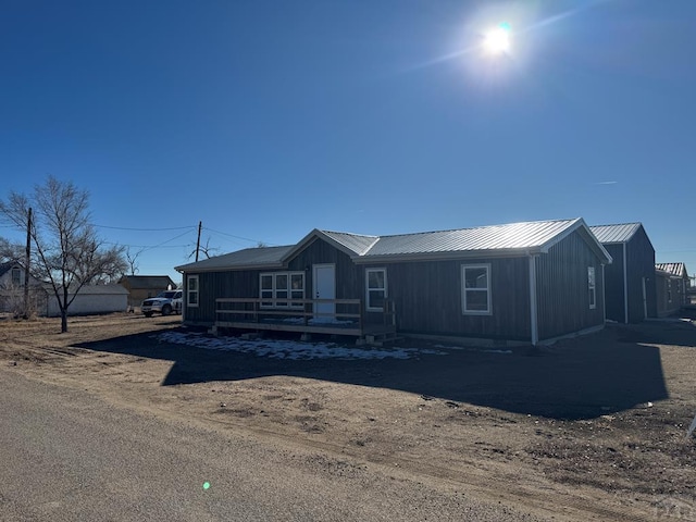 view of front of property featuring metal roof and board and batten siding