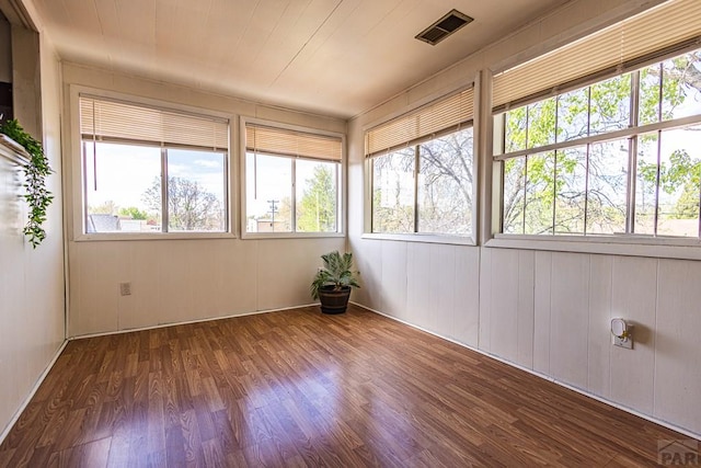 unfurnished sunroom with visible vents