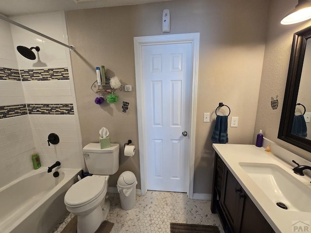 full bathroom featuring baseboards, toilet, shower / washtub combination, and vanity