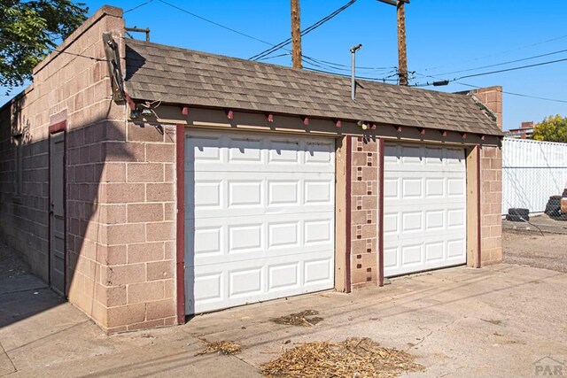 garage with fence