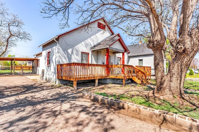 710 Wilson Ave, Pueblo, CO 81004 - view of front of property featuring a deck, fence, and driveway
