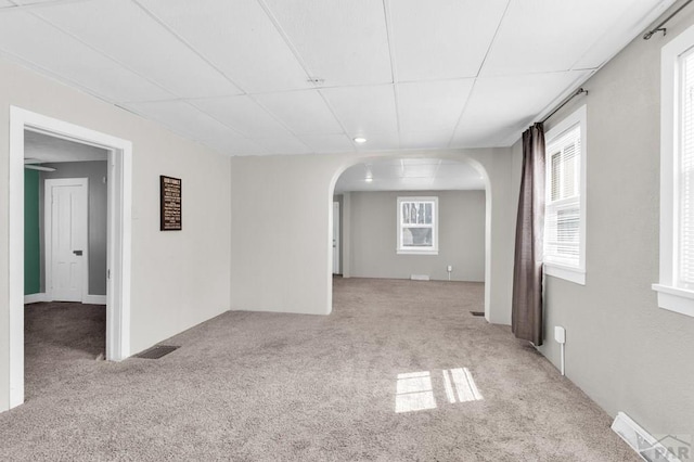 710 Wilson Ave, Pueblo, CO 81004 - carpeted spare room with arched walkways and a drop ceiling