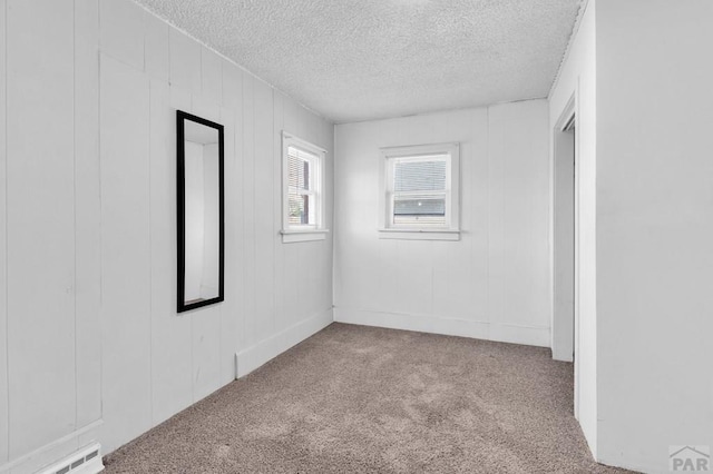 710 Wilson Ave, Pueblo, CO 81004 - carpeted empty room featuring a textured ceiling