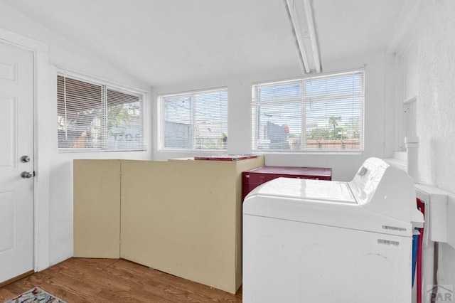 710 Wilson Ave, Pueblo, CO 81004 - laundry area with wood finished floors and washing machine and dryer