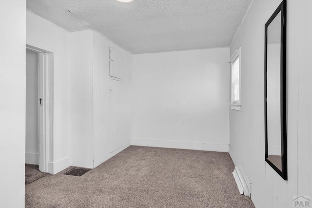 710 Wilson Ave, Pueblo, CO 81004 - carpeted empty room with a textured ceiling and baseboards