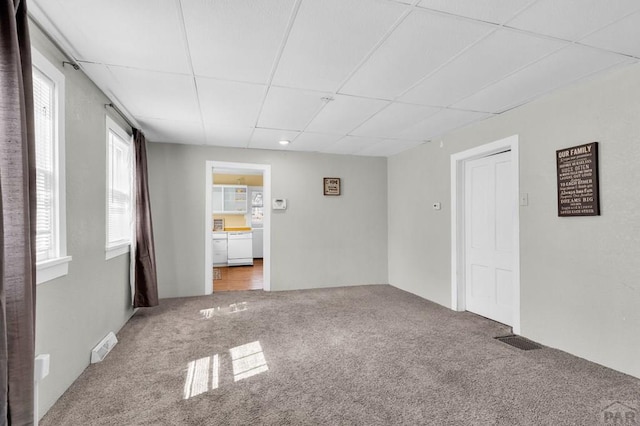 710 Wilson Ave, Pueblo, CO 81004 - empty room featuring carpet floors and a paneled ceiling