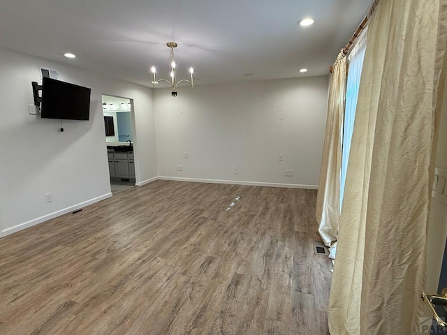 1318 Paseo Del Norte, Pueblo, CO 81008 - unfurnished living room with wood finished floors, a chandelier, recessed lighting, and baseboards
