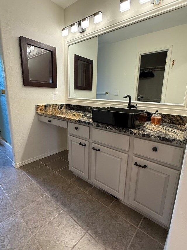 1318 Paseo Del Norte, Pueblo, CO 81008 - bathroom with tile patterned flooring, vanity, and baseboards