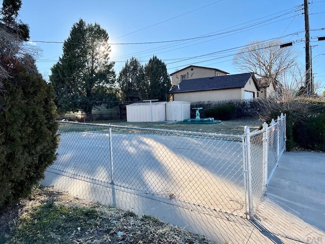 view of swimming pool with fence