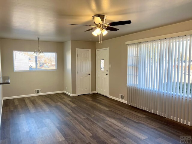 foyer with a ceiling fan, dark wood-style flooring, visible vents, and baseboards