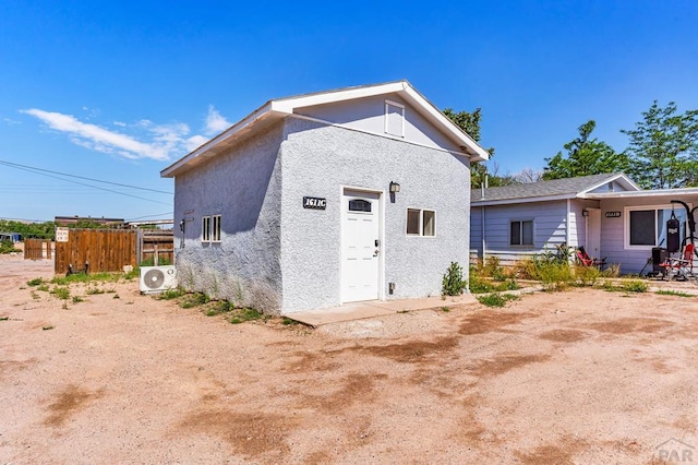 1611 San Juan St Unit B & C, Pueblo, CO 81006 - rear view of property featuring a cooling unit and stucco siding