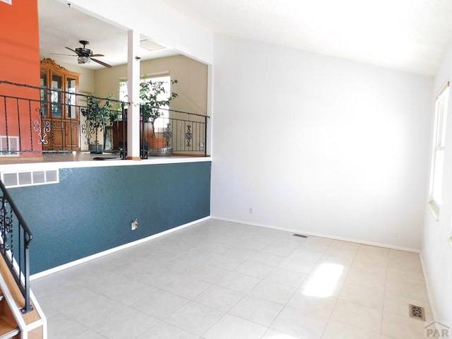 6 Ironweed Dr, Pueblo, CO 81001 - unfurnished room featuring baseboards, visible vents, a ceiling fan, and stairs