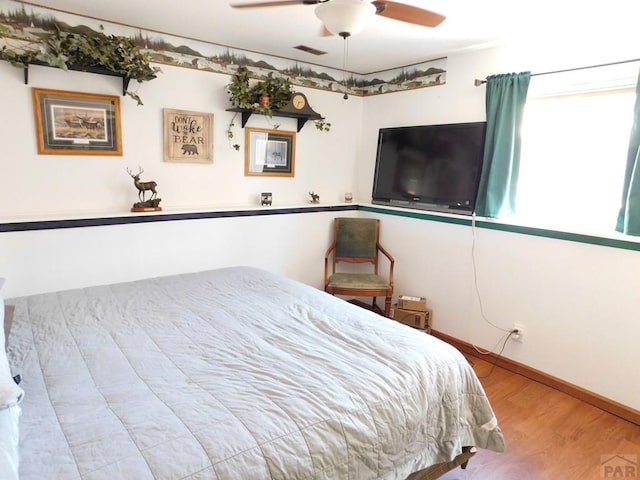 6 Ironweed Dr, Pueblo, CO 81001 - bedroom with visible vents, ceiling fan, wood finished floors, and baseboards