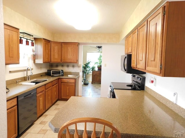 6 Ironweed Dr, Pueblo, CO 81001 - kitchen featuring a toaster, light countertops, black appliances, ceiling fan, and a sink