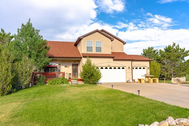 view of front of house featuring a shingled roof, a front yard, concrete driveway, and stucco siding