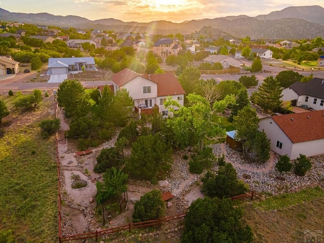 drone / aerial view featuring a residential view and a mountain view