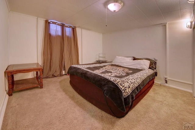 bedroom featuring light carpet